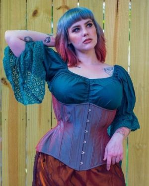 The outer layer of this corset is made of color-shifting, iridescent silk satin fabric in aqua that flashes with salmon-pink.