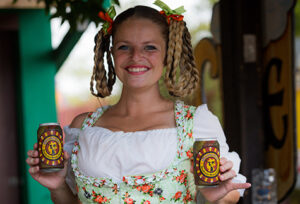 Girl with braids in Oktoberfest barmaid style dress